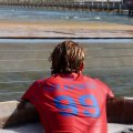 American surfer Griffin Colopinto watches from the sidelines.